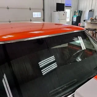 Close view of a tinted rear window.
